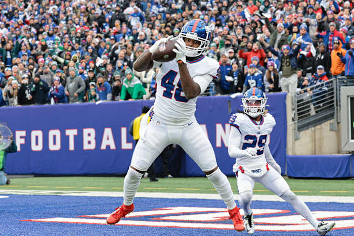 Nov 28, 2021; East Rutherford, New Jersey, USA; New York Giants inside linebacker Tae Crowder (48) intercepts a pass in front of free safety Xavier McKinney (29) during the first half against the Philadelphia Eagles at MetLife Stadium.